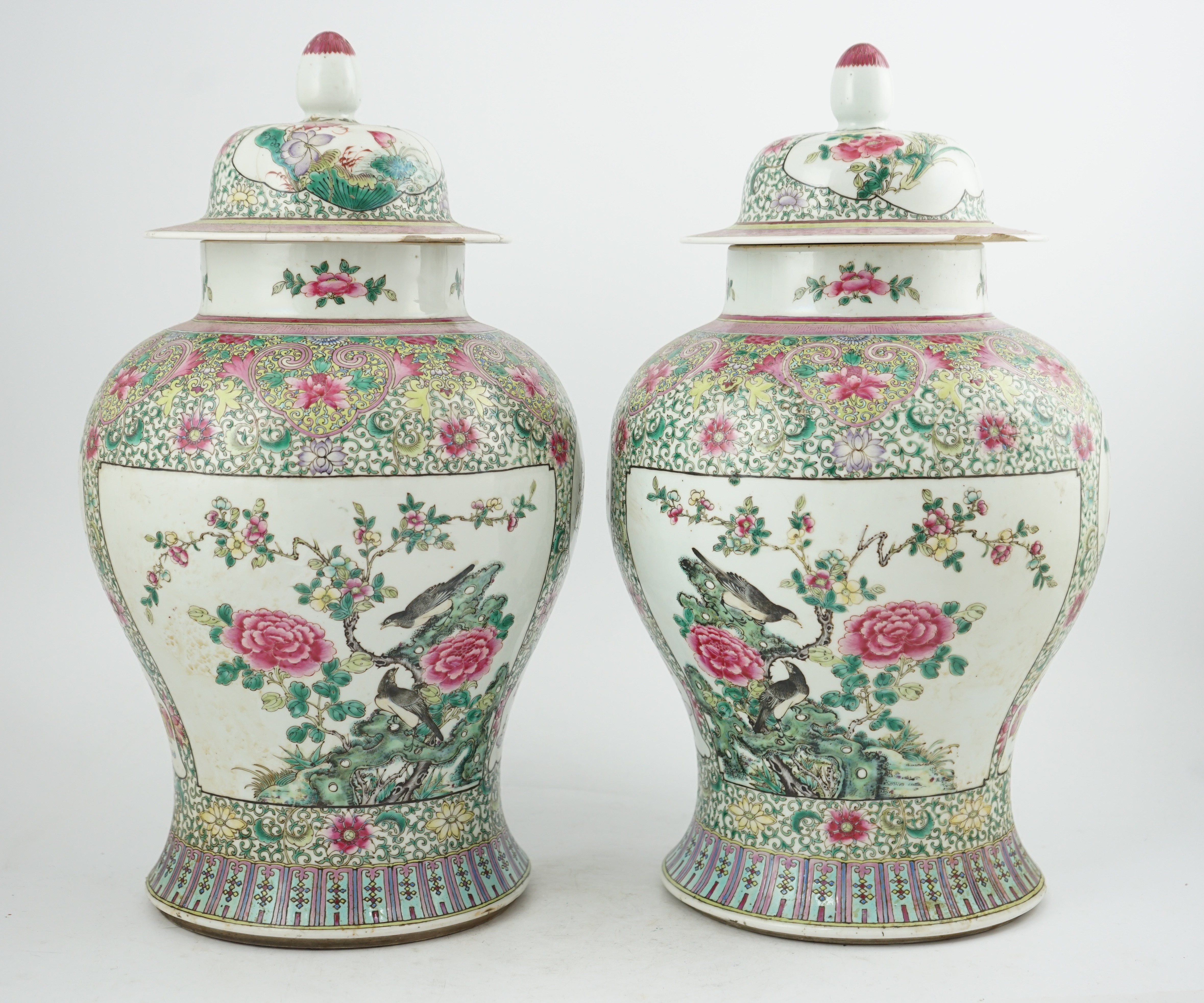 A pair of large Chinese famille rose baluster jars and covers, Qianlong seal mark, but late 19th century